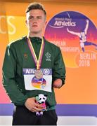23 August 2018; Jordan Lee of Ireland receives his bronze medal for competing in the T47 High Jump during the 2018 World Para Athletics European Championships at Friedrich-Ludwig-Jahn-Sportpark in Berlin, Germany. Photo by Luc Percival/Sportsfile