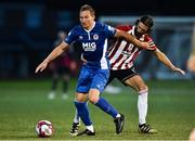 24 August 2018; Achille Campion of St Patrick's Athletic in action against Daniel Seabourne of Derry City during the Irish Daily Mail FAI Cup Second Round match between Derry City and St. Patrick's Athletic at Brandywell Stadium, in Derry. Photo by Oliver McVeigh/Sportsfile