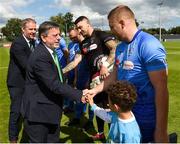 25 August 2018; Donal Conway President of the FAI shakes hands with North End United captain Paul Murphy before the President's Junior Cup Final match between North End United and Enniskillen Rangers at Home Farm FC in Whitehall, Dublin Photo by Matt Browne/Sportsfile