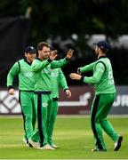 27 August 2018; Andy McBrine, left, and Andrew Balbirnie of Ireland congratulat each other after claiming the wicket of Rahmat Shah Zurmati of Afghanistan during the One Day International match between Ireland and Afghanistan at Stormont Cricket Ground, Belfast, Co. Antrim. Photo by Seb Daly/Sportsfile