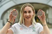 27 August 2018; Orla Comerford of Ireland with her Bronze medals from the Women's T13 100m and 200m events during the Team Ireland return from the 2018 World Para Athletics European Championships at Dublin Airport in Dublin. Photo by Piaras Ó Mídheach/Sportsfile