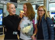 27 August 2018; Greta Streimikyte, centre, of Ireland with her Gold medal from the Women's T13 1500m event with her sister Emilija, left, and mother Asta as Team Ireland return from the 2018 World Para Athletics European Championships at Dublin Airport in Dublin. Photo by Sam Barnes/Sportsfile