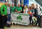 27 August 2018; Orla Comerford of Ireland with her Bronze medals from the Women's T13 100m and 200m events is welcomed home by family and friends during the Team Ireland return from the 2018 World Para Athletics European Championships at Dublin Airport in Dublin. Photo by Piaras Ó Mídheach/Sportsfile