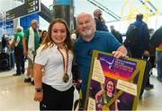 27 August 2018; Niamh McCarthy of Ireland with her Gold Medal from the Women’s F41 Discus event, pictured with her father Flor as Team Ireland return from the 2018 World Para Athletics European Championships at Dublin Airport in Dublin. Photo by Sam Barnes/Sportsfile