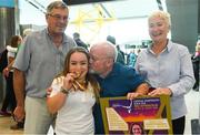 27 August 2018; Niamh McCarthy of Ireland with her Gold Medal from the Women’s F41 Discus event, pictured with family members, from left, uncle and godfather Frank Sweeney, father Flor, and auntie and godmother Claire Sweeney  as Team Ireland return from the 2018 World Para Athletics European Championships at Dublin Airport in Dublin. Photo by Sam Barnes/Sportsfile