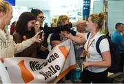 27 August 2018; Noelle Lenihan of Ireland, with her Gold medal from the F38 Discus event, is greeted by friends and family  as Team Ireland return from the 2018 World Para Athletics European Championships at Dublin Airport in Dublin. Photo by Sam Barnes/Sportsfile