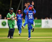 27 August 2018; Aftab Alam of Afghanistan, facing, celebrates with team-mate Hashmatullah Shaidi after claiming the wicket of Paul Stirling of Ireland during the One Day International match between Ireland and Afghanistan at Stormont Cricket Ground, Belfast, Co. Antrim. Photo by Seb Daly/Sportsfile