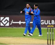 27 August 2018; Aftab Alam of Afghanistan, left, is congratulated by team-mate Rashid Khan Arman after catching out Andrew Balbirnie of Ireland during the One Day International match between Ireland and Afghanistan at Stormont Cricket Ground, Belfast, Co. Antrim. Photo by Seb Daly/Sportsfile