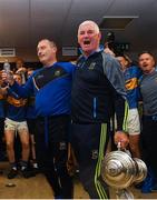 26 August 2018; Tipperary manager Liam Cahill, left, and selector John Sheedy celebrate with the the James Nowlan Cup with their players in the dressing room after the Bord Gais Energy GAA Hurling All-Ireland U21 Championship Final match between Cork and Tipperary at the Gaelic Grounds in Limerick. Photo by Piaras Ó Mídheach/Sportsfile