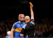 26 August 2018; Dillon Quirke of Tipperary is shown the yellow card by referee John Keenan during the Bord Gais Energy GAA Hurling All-Ireland U21 Championship Final match between Cork and Tipperary at the Gaelic Grounds in Limerick. Photo by Piaras Ó Mídheach/Sportsfile