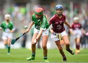 19 August 2018; Niamh Toland, St Patrick's Girls, Carndonagh, Donegal, representing Limerick, in action against Kate Ní Riain, Gaelscoil Eiscir Riada Leamhchán, Co Dublin, representing Galway, during the INTO Cumann na mBunscol GAA Respect Exhibition Go Games at the GAA Hurling All-Ireland Senior Championship Final match between Galway and Limerick at Croke Park in Dublin. Photo by Eóin Noonan/Sportsfile