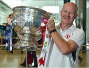 31 August 2018; Tyrone supporter Sean O'Neill, originally from Killeeshil, Co. Tyrone, now living in San Francisco, and home for the match, with the Sam Maguire Cup at the GAA Fáilte Abhaile event at Dublin Airport in Dublin. Photo by Seb Daly/Sportsfile