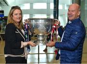31 August 2018; Catriona Crowe, from Blackrock, Dublin, and Damian Sharpe, from Pomeroy, Co Tyrone, home for the match, with the Sam Maguire Cup at the GAA Fáilte Abhaile event at Dublin Airport in Dublin. Photo by Seb Daly/Sportsfile