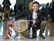 31 August 2018; Cian Galvin, age 9, from London, playing with the North London Shamrocks, with the Sam Maguire Cup at the GAA Fáilte Abhaile event at Dublin Airport in Dublin. Photo by Seb Daly/Sportsfile