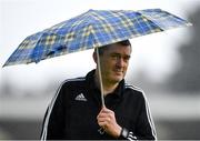 31 August 2018; Assistant referee Ciaran Delaney walks the pitch under the shelter of an umbrella ahead of the SSE Airtricity League Premier Division match between Cork City and Sligo Rovers at Turner's Cross in Cork. Photo by Eóin Noonan/Sportsfile