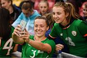 31 August 2018; Harriet Scott of Republic of Ireland poses for a photograph with a supporter following the 2019 FIFA Women's World Cup Qualifier match between Republic of Ireland and Northern Ireland at Tallaght Stadium in Dublin. Photo by Stephen McCarthy/Sportsfile
