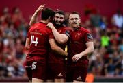 1 September 2018; Darren Sweetnam of Munster, left, is congratulated by team-mates Sam Arnold and Rory Scannell after scoring his side's sixth try during the Guinness PRO14 Round 1 match between Munster and Toyota Cheetahs at Thomond Park in Limerick. Photo by Diarmuid Greene/Sportsfile