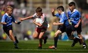 2 September 2018; Tomás Kennedy, Scoil Eoin, Balloonagh, Tralee, Co Kerry, representing Tyrone, in action against Alex Craig, Scoil Naomh Eoin, Killenard, Co Laois, representing Dublin, and Darragh Booth, Scoil Mhuire, Newbridge, Co Kildare, representing Dublin, during the INTO Cumann na mBunscol GAA Respect Exhibition Go Games at the Electric Ireland GAA Football All-Ireland Minor Championship Final match between Kerry and Galway at Croke Park in Dublin. Photo by Eóin Noonan/Sportsfile