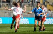 2 September 2018; Grace Quinn, St John's P. Dernaflaw, Co Derry, representing Tyrone, in action against Lisa Seery, Ardnagrath NS, Athlone, Co Westmeath, representing Dublin, during the INTO Cumann na mBunscol GAA Respect Exhibition Go Games at the Electric Ireland GAA Football All-Ireland Minor Championship Final match between Kerry and Galway at Croke Park in Dublin. Photo by Oliver McVeigh/Sportsfile