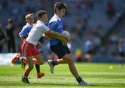 2 September 2018; Evan Moynihan, St Mary's BNS, Rathfarnham, Co Dublin, in action against Tom Curran, Barefield NS, Ennis, Co Clare, representing Tyrone, during the INTO Cumann na mBunscol GAA Respect Exhibition Go Games at the Electric Ireland GAA Football All-Ireland Minor Championship Final match between Kerry and Galway at Croke Park in Dublin. Photo by Ray McManus/Sportsfile