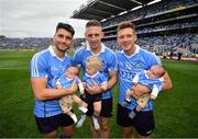 2 September 2018; Dublin's Bernard Brogan, left, and Paul Flynn, right, holding twins Keadán, left, and Donagh Borgan and Eoghan O'Gara with Fiadh O'Gara following the GAA Football All-Ireland Senior Championship Final match between Dublin and Tyrone at Croke Park in Dublin. Photo by Stephen McCarthy/Sportsfile