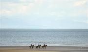 6 September 2018; Runners and riders make their way across the beach prior to the Laytown Strand Races at Laytown in Meath. Photo by David Fitzgerald/Sportsfile