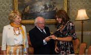 7 September 2018; President of Ireland Michael D Higgins and his wife Sabina greet team captain Katie Mullen during a reception to honour the Ireland Women’s Hockey team and their performance at the 2018 Women’s Hockey World Cup at Áras an Uachtaráin in Phoenix Park, Dublin. Photo by Piaras Ó Mídheach/Sportsfile