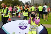 8 September 2018; parkrun Ireland in partnership with Vhi, added their 96th event on Saturday, 8th September, with the introduction of the Mungret parkrun in Co. Limerick. parkruns take place over a 5km course weekly, are free to enter and are open to all ages and abilities, providing a fun and safe environment to enjoy exercise. To register for a parkrun near you visit www.parkrun.ie. Pictured during the Mungret parkrun is volunteer photographer Jane Lynch, aged 11, from Tralee, Co. Kerry, who has attened over 100 parkruns. Photo by Diarmuid Greene/Sportsfile