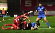 8 September 2018; Fergus McFadden of Leinster goes over to score his side's first try despite the tackle of Leigh Halfpenny, 15, and Rob Evans, 1, of Scarlets during the Guinness PRO14 Round 2 match between Scarlets and Leinster at Parc y Scarlets in Llanelli, Wales. Photo by Stephen McCarthy/Sportsfile