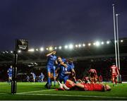 8 September 2018; Fergus McFadden, 14, is congratulated by his Leinster team-mates Ross Byrne, left, Rory O'Loughlin and Jordan Larmour, right, after scoring his side's opening try, as Rob Evans of Scarlets reacts to conceeding, during the Guinness PRO14 Round 2 match between Scarlets and Leinster at Parc y Scarlets in Llanelli, Wales. Photo by Stephen McCarthy/Sportsfile