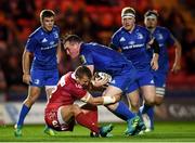 8 September 2018; Peter Dooley of Leinster is tackled by Hadleigh Parkes of Scarlets during the Guinness PRO14 Round 2 match between Scarlets and Leinster at Parc y Scarlets in Llanelli, Wales. Photo by Stephen McCarthy/Sportsfile
