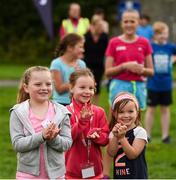9 September 2018; parkrun Ireland in partnership with Vhi, expanded their range of junior events to 17 with the introduction of the Shelbourne Park junior parkrun on Sunday morning. Junior parkruns are 2km long and cater for 4 to 14-year olds, free of charge providing a fun and safe environment for children to enjoy exercise. Pictured during the warm-up for the junior parkrun at Shelbourne Park in Limerick are Faye O'Sullivan, age 6, from Old Cratloe Road, Willow Keely, age 6, from Clareview, and Aoife Dillane, age 4, from Mayorstone. Photo by Diarmuid Greene/Sportsfile