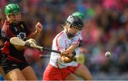 9 September 2018; Caitríona Collins of Cork scores her side's first goal despite the efforts of Allannah Savage of Down during the Liberty Insurance All-Ireland Intermediate Camogie Championship Final match between Cork and Down at Croke Park in Dublin. Photo by Piaras Ó Mídheach/Sportsfile