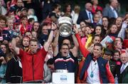 9 September 2018; Brothers, from left, Logistics manager Damian, coach Kevin and manager Paudie Murray lift the cup following the Liberty Insurance All-Ireland Senior Camogie Championship Final match between Cork and Kilkenny at Croke Park in Dublin. Photo by David Fitzgerald/Sportsfile