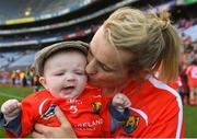 9 September 2018; Briege Corkery of Cork celebrates with her son Tadhg Scannell, age five months, after the Liberty Insurance All-Ireland Senior Camogie Championship Final match between Cork and Kilkenny at Croke Park in Dublin. Photo by Piaras Ó Mídheach/Sportsfile