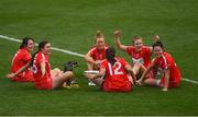9 September 2018; Cork players, from left, Chloe Sigerson, Hannah Looney, Laura Treacy, Orla Cotter, Libby Coppinger, and Gemma O'Connor relax with the O'Duffy Cup after the Liberty Insurance All-Ireland Senior Camogie Championship Final match between Cork and Kilkenny at Croke Park in Dublin. Photo by Piaras Ó Mídheach/Sportsfile