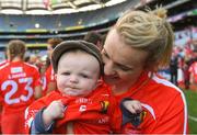9 September 2018; Briege Corkery of Cork celebrates with her son Tadhg Scannell, age five months, after the Liberty Insurance All-Ireland Senior Camogie Championship Final match between Cork and Kilkenny at Croke Park in Dublin. Photo by Piaras Ó Mídheach/Sportsfile