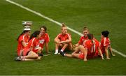 9 September 2018; Cork players, from left, Hannah Looney, Orla Cotter, Chloe Sigerson, Laura Treacy, Libby Coppinger, Orla Cronin and Gemma O'Connor relax with the O'Duffy Cup after the Liberty Insurance All-Ireland Senior Camogie Championship Final match between Cork and Kilkenny at Croke Park in Dublin. Photo by Piaras Ó Mídheach/Sportsfile