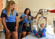 10 September 2018; Morgan Boylan, age 6, from Aughrim, Wicklow, with Cork camogie players Niamh Ní Chaoimh, right, and Sarah Harrington during the All-Ireland Senior Camogie Champions visit to Our Lady's Children's Hospital in Crumlin, Dublin. Photo by Eóin Noonan/Sportsfile