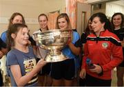 10 September 2018; Sally Fox, age 14, from Shannon, Clare, with the cup alongside Cork camogie players during the All-Ireland Senior Camogie Champions visit to Our Lady's Children's Hospital in Crumlin, Dublin. Photo by Eóin Noonan/Sportsfile