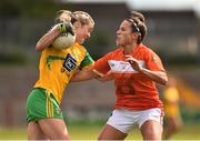 4 August 2018; Yvonn Bonner of Donegal  in action against Sharon Reel of Armagh during the TG4 All-Ireland Ladies Football Senior Championship quarter-final match between Armagh and Donegal at Healy Park in Omagh, Tyrone. Photo by Oliver McVeigh/Sportsfile