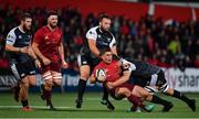 14 September 2018; Ian Keatley of Munster is tackled by Alex Jeffries and Olly Cracknell of Ospreys during the Guinness PRO14 Round 3 match between Munster and Ospreys at Irish Independent Park in Cork. Photo by Brendan Moran/Sportsfile
