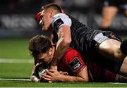 14 September 2018; Darren Sweetnam of Munster goes over to score his side's seventh try despite the tackle of Tom Williams of Ospreys during the Guinness PRO14 Round 3 match between Munster and Ospreys at Irish Independent Park in Cork. Photo by Brendan Moran/Sportsfile