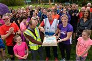 15 September 2018; Willie Kelly, Gerry Galvin and Cora Staunton cut a birthday  cake at the Westport parkrun where Vhi hosted a special event to celebrate their partnership with parkrun Ireland.  Vhi ambassador and four-time All-Ireland Final winner, Cora Staunton was on hand to lead the warm up for parkrun participants before completing the 5km free event. parkrunners enjoyed refreshments post event at the Vhi Relaxation Area where a physiotherapist took participants through a post event stretching routine.   parkrun in partnership with Vhi support local communities in organising free, weekly, timed 5k runs every Saturday at 9.30am.To register for a parkrun near you visit www.parkrun.ie. Photo by Ray Ryan/Sportsfile