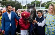 15 September 2018; Winning jockey Oisin Murphy kisses Roaring Lion with winning connections in the winners enclosure following The QIPCO Irish Champion Stakes during Irish Champions Stakes Day during the Leopardstown Races at Leopardstown in Dublin. Photo by Sam Barnes/Sportsfile