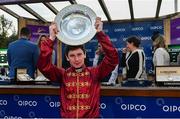 15 September 2018; Winning Jockey Oisin Murphy lifts the trophy after winning The QIPCO Irish Champion Stakes on Roaring Lion during Irish Champions Stakes Day during the Leopardstown Races at Leopardstown in Dublin. Photo by Sam Barnes/Sportsfile