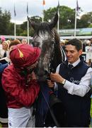 15 September 2018; Winning jockey Oisin Murphy kisses Roaring Lion in the winners enclosure following The QIPCO Irish Champion Stakes during Irish Champions Stakes Day during the Leopardstown Races at Leopardstown in Dublin.  Photo by Sam Barnes/Sportsfile