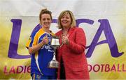 15 September 2018; Marie Hickey, President, LGFA, presents Lisa Cafferkey of Parnells, London, with the Intermediate Championship Final trophy after they beat Tuam Cortoon of Galway during the 2018 LGFA All-Ireland Club 7s at Naomh Mearnóg & St Sylvesters in Dublin. Photo by Piaras Ó Mídheach/Sportsfile