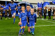 15 September 2018; Mascots Nina Merry and James O'Reilly with Leinster captain Jonathan Sexton prior to the Guinness PRO14 Round 3 match between Leinster and Dragons at the RDS Arena in Dublin. Photo by Brendan Moran/Sportsfile