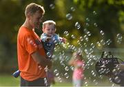 16 September 2018; Tadhg Judge, age 2, from Ballinteer, Co Dublin, with his dad Barry, at the Marlay Junior parkrun, at Marley Park in Dublin, where Vhi hosted a special event to celebrate their partnership with parkrun Ireland. Vhi hosted a lively warm up routine which was great fun for children and adults alike. Crossing the finish line was a special experience as children were showered with bubbles and streamers to celebrate their achievement and each child received a gift. Junior parkrun in partnership with Vhi support local communities in organising free, weekly, timed 2km runs every Sunday at 9.30am. To register for a parkrun near you visit www.parkrun.ie. Photo by Piaras Ó Mídheach/Sportsfile